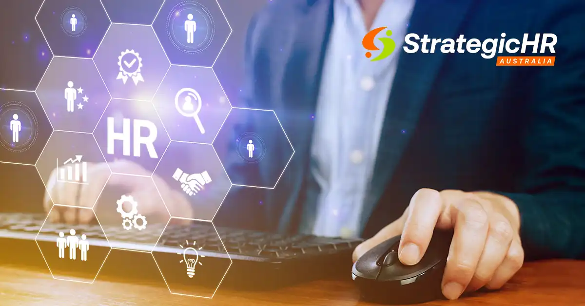 A person in a business suit uses a computer mouse and keyboard, illustrating the impact of AI in HR. The StrategicHR Australia logo is at the top right, with transparent HR-related icons displayed on the left side of the image.