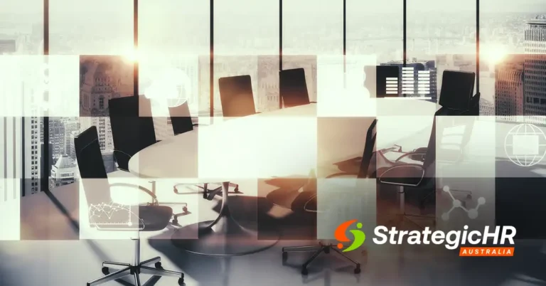 A modern office conference room with a large round table and empty chairs, city skyline visible through tall windows, overlaid with digital business graphics and the StrategicHR Australia logo in the corner.